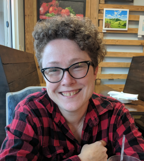 A smiling redheaded upholsterer woman in Pensacola